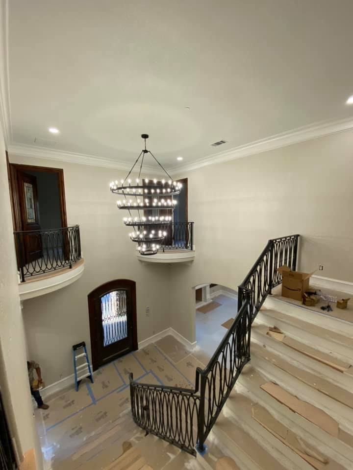 Grand foyer tiered chandelier installation